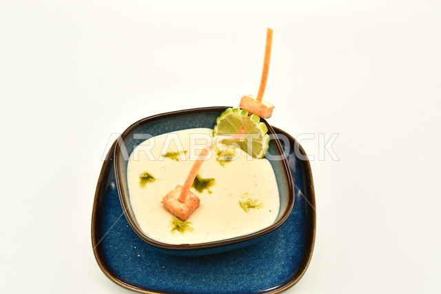 Light meal and healthy food, vegetable soup with spices and herbs, delicious hot appetizer, traditional popular dish and food, oriental food and meals, kitchen and restaurant in Saudi Arabia, white background