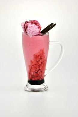 Healthy, beneficial and nutritious drinks, delicious cold natural juices, refreshing seasonal fruit drinks, Saudi agricultural crops and local national fruits, a glass of delicious summer fruit juice, white background