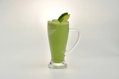 Healthy, beneficial and nutritious drinks, delicious cold natural juices, refreshing seasonal fruit drinks, Saudi agricultural crops and local national fruits, a glass of delicious summer fruit juice, white background
