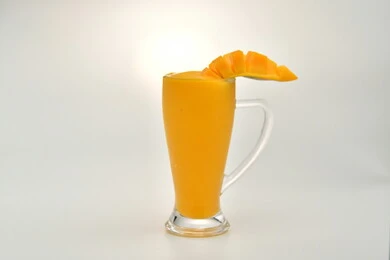 Healthy, beneficial and nutritious drinks, delicious cold natural juices, refreshing seasonal fruit drinks, Saudi agricultural crops and local national fruits, a glass of delicious summer fruit juice, white background