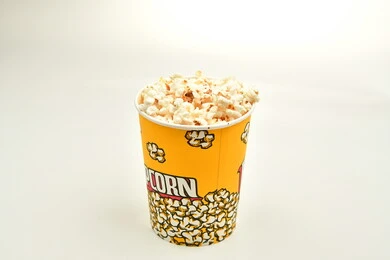 Bucket full of popcorn, delicious popcorn, tasty snack, salty arabic snack, white background