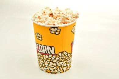 Bucket full of popcorn, delicious popcorn, tasty snack, salty arabic snack, white background