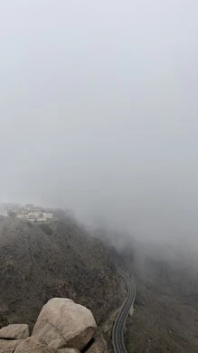 Recreational and recreational places in the Kingdom of Saudi Arabia, the fog walkway in the Asir region, foggy weather in the city of Abha, famous tourist places and landmarks, nature background
