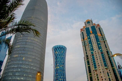Modern urban growth and development of buildings overlooking the Corniche in the State of Qatar, modern buildings and towers, architectural engineering in the construction of skyscrapers and hotels in the city of Doha