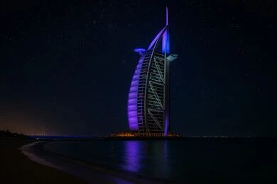 Burj Al Arab in Dubai, United Arab Emirates, at night, attractions and draws tourists from all over the world, modern and advanced architectural designs, tourist attractions and landmarks, urban development and progress of facilities, architectural art of towers and skyscrapers