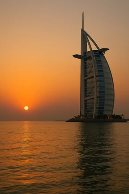برج العرب في دبي بالامارات العربية المتحدة وقت غروب الشمس، مناطق جذب واستقطاب السياح من جميع انحاء العالم، التصاميم الهندسية المعمارية على الطراز الحديث والمتطور، أماكن ومعالم ترفيهية سياحية، التطور والتقدم العمراني للمنشآت, الفن الهندسي للابراج وناطحات السحاب