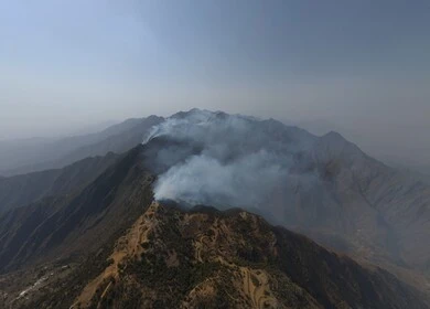 Al-Sahaleel and Al-Raith Mountains in the Jazan region, a natural tourist place and area, trees, plants and green spaces, agricultural terraces on the mountain slopes, peaks and rocky heights during the day