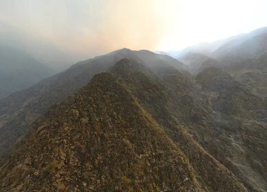 Al-Sahaleel and Al-Raith Mountains in the Jazan region, a natural tourist place and area, trees, plants and green spaces, agricultural terraces on the mountain slopes, peaks and rocky heights during the day