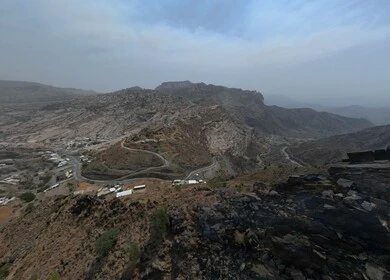 Al-Sahaleel and Al-Raith Mountains in the Jazan region, a natural tourist place and area, trees, plants and green spaces, agricultural terraces on the mountain slopes, peaks and rocky heights during the day