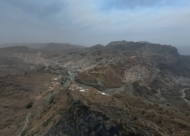 Al-Sahaleel and Al-Raith Mountains in the Jazan region, a natural tourist place and area, trees, plants and green spaces, agricultural terraces on the mountain slopes, peaks and rocky heights during the day
