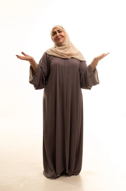The feeling of confusion and ignorance about something, hesitation and lack of knowledge regarding a specific matter, a portrait of an elderly Arab Saudi Gulf woman wearing a hijab and an abaya, raising her hands in gestures of elevation, full-body image, white background.