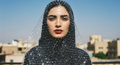 Entertainment and recreation with children's games, spending time with fun and entertaining recreational activities, a close-up image of a veiled Saudi Arabian Gulf woman wearing a black abaya and a bubble head covering as a symbol of protection and containment during the day