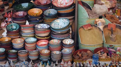 Popular pottery and glassware, historical landmarks and tourist sites in Qatar, handicrafts and crafts, a collection of traditional dishes and utensils made of porcelain and pottery in one of the old popular markets, spice and herb mixtures