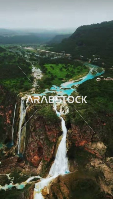 Tourist places for hiking and spending a pleasant time, Wadi Darbat in the Wilayat of Taqah in the Dhofar Governorate, natural waterfalls on the mountain slopes and foothills, Salalah waterfalls in the Sultanate of Oman, enjoying the natural scenery among the trees and dense green plants on the mountains