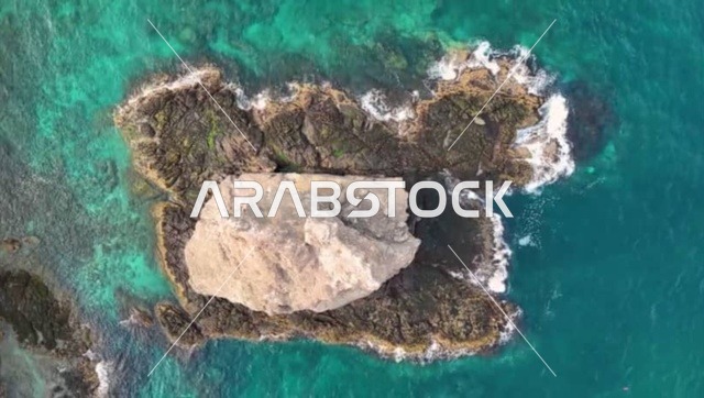 Sidab Rocky Beach in Muscat Governorate, a tourist destination for recreation, entertainment, and spending a pleasant time, enjoying the natural scenery, mountainous coastal areas for summer vacation in the Sultanate of Oman