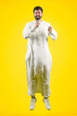 Integrating modern technologies and technology into practical life, communicating with family and friends, following the latest news and developments around the world, side portrait of a young Emirati Gulf Arab man wearing a kandura using a mobile phone, full body, yellow background