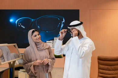 International brands and types, the pleasure of shopping in the UAE malls, keeping up with the latest fashion and beauty trends, elegance and attention to one's appearance, an Arab Gulf Emirati couple choosing sunglasses that suit their facial features, protecting their eyes from the sun's rays
