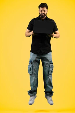 Watching movies and series, portrait of a young Saudi Arabian Gulf man wearing casual clothes holding a laptop, browsing social media, the concept of hard work and completing required tasks, an Emirati man looking at a computer, full body, yellow background