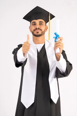 Thumbs up gesture, occasion and joy of success, taking selfies in graduation gown, celebrating the completion of university, portrait of a young Arab Gulf Emirati graduate wearing a graduation cap and gown holding a certificate looking at the camera with gestures of pleasure, white background