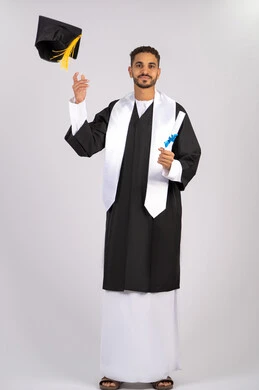 Throwing the hat up with expressions of joy and happiness, quality of education in the Emirates, feeling proud and happy to achieve the dream of graduation, portrait of a young Arab Gulf Emirati graduate wearing an abaya holding a certificate in his hand, celebrating the completion of the university stage, full body, white background