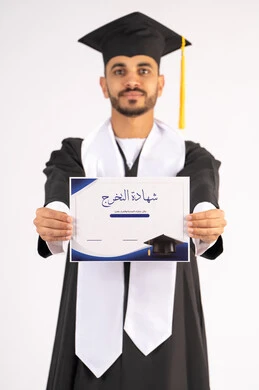 Feeling proud and confident, celebrating success and completing university studies, the concept of excellence and diligence, a portrait of an Arab Gulf Emirati graduate wearing a graduation cap and gown, standing straight with happy gestures, holding a certificate with expressions of joy and happiness, white background