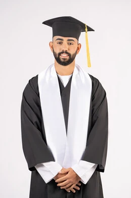 Grandfather, success and diligence, taking selfies in graduation gowns, celebrating the completion of university, portrait of a smiling young Arab Gulf Emirati graduate wearing a graduation cap and gown, standing straight and looking at the camera with expressions of self-confidence, pleasure and happiness, white background