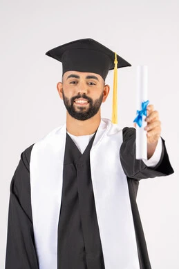 Holding a certificate with expressions of joy and happiness, feeling proud and self-confident, celebrating success and completing university studies, the concept of excellence and diligence, a portrait of an Arab Gulf Emirati graduate wearing a graduation cap and gown, standing straight with gestures of happiness, white background