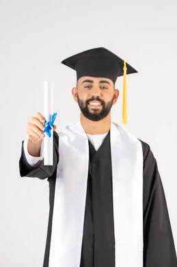 Holding a certificate with expressions of joy and happiness, feeling proud and self-confident, celebrating success and completing university studies, the concept of excellence and diligence, a portrait of an Arab Gulf Emirati graduate wearing a graduation cap and gown, standing straight with gestures of happiness, white background