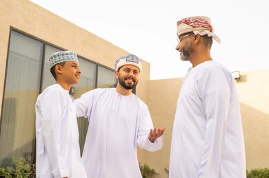 The role of the father in the lives of children, strengthening family bonds, spending the weekend in an Omani chalet, sharing wonderful moments for an Omani family, a family reception in the garden of one of the chalets, hugs between grandparents and grandchildren, enjoying fun times with family members, family visits and family gatherings.