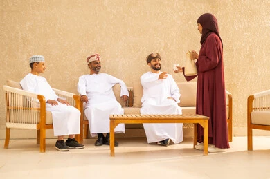 Spending enjoyable family time, visiting relatives and family, recreational resorts and chalets in Oman, Arab hospitality, Arabic coffee, a Gulf Arab Omani family enjoying time in one of the tourist chalets in the Sultanate of Oman, family entertainment activities, summer vacation, family atmosphere.