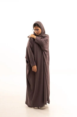 The feeling of pain and fatigue, seeking help and the need for treatment, nerve and muscle aches and pains, inflammation of the muscles and joints, a portrait of an Arab Saudi Gulf woman wearing an abaya and hijab, placing her hand on her shoulder with gestures of exhaustion, full-body, white background.