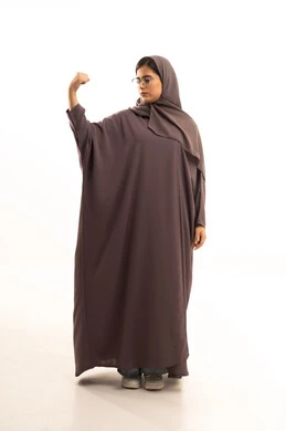 The concept of physical fitness, physical health, and exercising to maintain a healthy body, a portrait of a Saudi Arabian Gulf woman wearing a hijab and abaya standing with facial and hand gestures indicating strength, full-body, white background. The concept of physical fitness, physical health, and exercising to maintain a healthy body, a portrait of a Saudi Arabian Gulf woman wearing a hijab and abaya standing with facial and hand gestures indicating strength, full-body, white background.