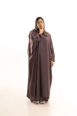 Contemplation, focus, and planning for the future, a portrait of a Gulf Arab Saudi woman wearing an abaya and hijab trying to find a solution to a problem, resting her hand under her chin and looking at the camera with gestures of thought and reflection, full-body, white background.