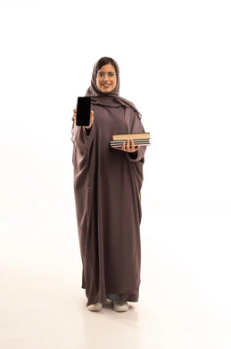 A blank black screen displayed on the mobile phone, searching and browsing through the mobile, a portrait of a Saudi Gulf Arab student wearing an abaya and hijab holding a mobile phone and a collection of books, browsing applications and social media, full-body shot, white background.