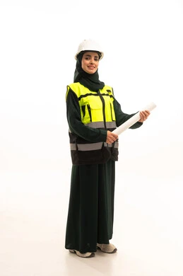Architectural structural plans, monitoring engineering works, a portrait of a smiling Saudi Gulf Arab engineer wearing an abaya, a safety helmet, and a work vest, standing with gestures of confidence and pride, looking at the camera with expressions of happiness, the development and growth of Saudi Arabia in the field of engineering and construction by the hands of the nation's sons, full-body, white background.