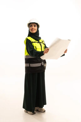 Development and evolution of the engineering field, looking at something, attention to work affairs, progress and development of Saudi Arabia by the sons of the nation, a portrait of a veiled Gulf Arab engineer wearing a helmet and protective vest holding a construction plan, reviewing the construction plan, full-body, white background.