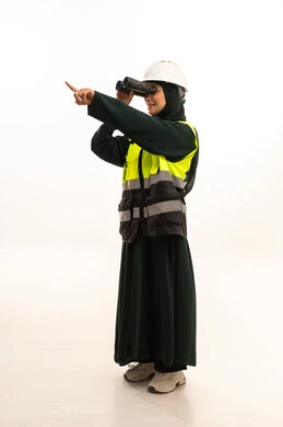 Referring to something, following the progress of engineering projects, professions and jobs for women, seeing distant objects, a portrait of a Saudi Gulf Arab female engineer wearing an abaya, helmet, and safety vest looking through binoculars, full-body, white background.