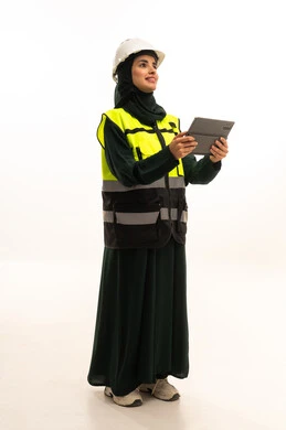 The adoption of modern technologies and technology in engineering, achieving the industrial revolution and efficiency in production and manufacturing, a portrait of an Arab Saudi Gulf industrial engineer wearing a vest and safety helmet monitoring the factory operations using a tablet, Saudi women's professions and jobs, full-body, white background.