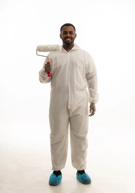 A portrait of a young Saudi Gulf man working as a technical engineer practicing his profession professionally, a skilled painter, finishing tools and equipment, skill and mastery of work, a professional painter, white background.