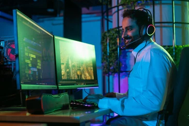 Expressions of joy and happiness, the use of advanced editing software, a side image of a Gulf Arab Saudi editor wearing a white thobe and headphones, working in the editing room using a laptop to cut and arrange scenes, the concept of visual content creation and artistic creativity.