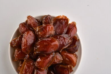 a plate full of dates, Khalas dates healthy and delicious dates, a bowl of treasured dates, Saudi Arabia dates, Medina dates