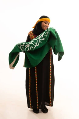 Pride and boasting of the country's achievements, pride in historical heritage, Flag Day March 11, the day we started in 1727 AD, wearing the Central Region costume, Saudi National Day September 23, portrait of a Saudi Arabian Gulf woman wearing a kurta and a head holding the Kingdom's flag, full-length body, white background