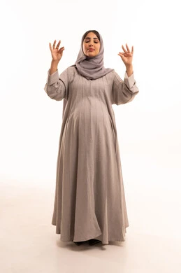 The concept of acceptance and approval, a sign of quality and excellence, expressions of joy and happiness, a portrait of a pregnant Arab Gulf Saudi woman wearing an abaya and hijab, raising her hands with gestures indicating admiration and satisfaction, full-body image, white background.