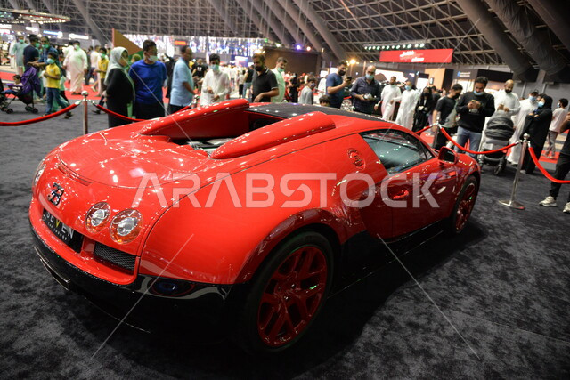 Red Bugatti Veyron, fast car, Jeddah International Motor Show in the dome city of Jeddah in Saudi Arabia, classic car show in Jeddah, events and exhibitions of cars in Saudi Arabia