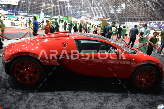 Red Bugatti Veyron, fast car, Jeddah International Motor Show in the dome city of Jeddah in Saudi Arabia, classic car show in Jeddah, events and exhibitions of cars in Saudi Arabia