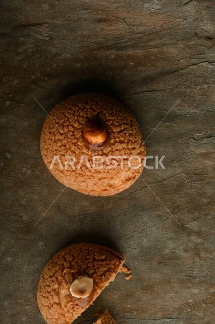 Sweetened dough, donuts, benz, coffee sweets, pieces of sweets cut on a table.