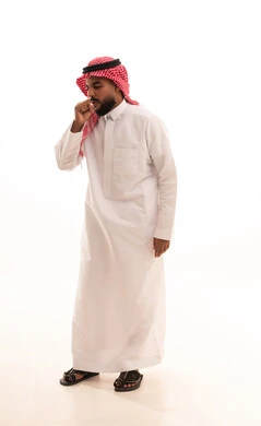 Influenza and pneumonia, feeling sick and coughing, a portrait of an Arab Gulf Saudi man wearing a white thobe and a ghutrah suffering from a cough, infected with the coronavirus, feeling tired and exhausted, full-body shot, white background.