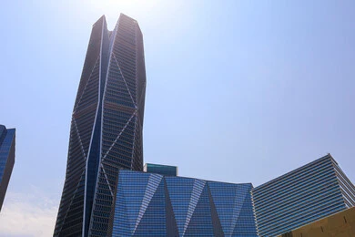 The ideal destination for finance and business with international standards, modern architectural style for commercial buildings, King Abdullah Financial District (KAFD) towers in Riyadh, Saudi Arabia, achieving economic renaissance, leading companies in banking services