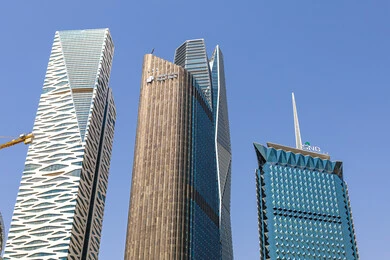 The ideal destination for finance and business with international standards, modern architectural style for commercial buildings, King Abdullah Financial District (KAFD) towers in Riyadh, Saudi Arabia, achieving economic renaissance, leading companies in banking services