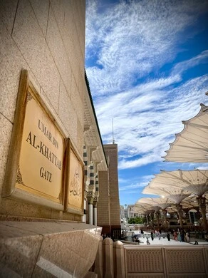 Al-Khatib Gate in Medina, electronic canopies in the Prophet's Mosque, the concept of worship and closeness to God, performing the obligatory prayer on time, a sacred religious place and landmark in the Kingdom of Saudi Arabia, design and decoration in the Islamic style